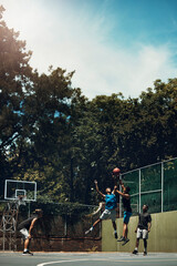 Wall Mural - Sports, team and men play basketball in a competition for game or sport players with talent, skill and fitness. People in a competitive training match on outdoor court with teamwork for fun or health