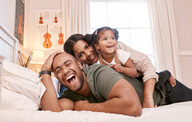 Canvas Print - Theres no better bond than a family bond. Shot of a young family relaxing at home.