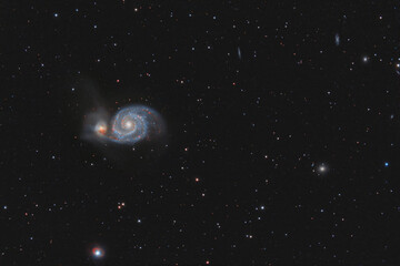 Wall Mural - galaxy m51 photographed through a telescope. photo of real outer space. stars and galaxies on a dark