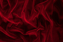 Dark Elegant Wallpaper Made Of Red Tulle Fabric. Aesthetic Fashion, Passion And Love Background.