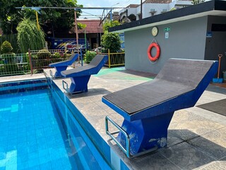 Jumping stand on the side of swimming pool for starting position in a aqua park.