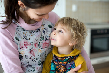 Poster - Mother, hugging sweet toddler child, blond boy at home