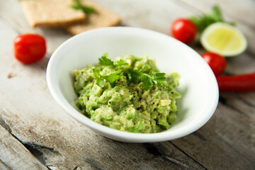 Wall Mural - Healthy mashed avocado with lime juice