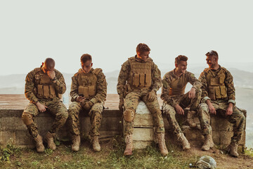 Wall Mural - Soldiers squad relaxing after battle having a break on training