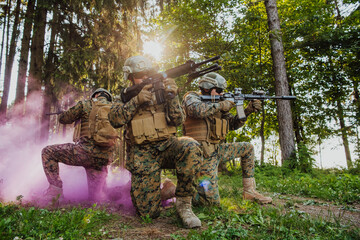 Wall Mural - Soldier fighters standing together with guns. Group portrait of US army elite members, private military company servicemen, anti terrorist squad