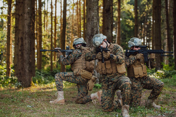 Wall Mural - Soldier fighters standing together with guns. Group portrait of US army elite members, private military company servicemen, anti terrorist squad