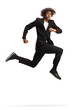 © Ljupco Smokovski - Full length shot of a young african american man in a black suit jumping