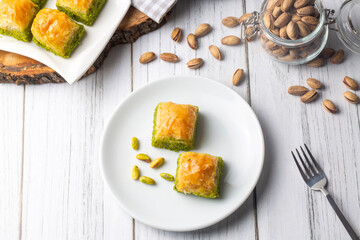 Wall Mural - Traditional delicious Turkish dessert; pistachio baklava (Turkish name; kuru baklava)