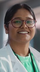 Aufkleber - Vertical Screen: Portrait Close Up of Young Indian Female Specialist Wearing Lab Coat and Glasses Smiling. Professional and Successful Woman Working as an Engineer, Developing High Technology Projects