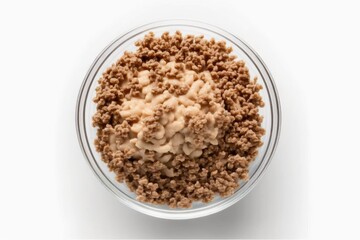 Poster - Close up of raw soy mince in a glass bowl on a white background. Top view of soy meat substitute. Generative AI