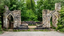Scenic View Of The Stone Ruins In Woodland At Country Park