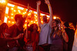 © bernardbodo - cheerful friends dancing at festival
