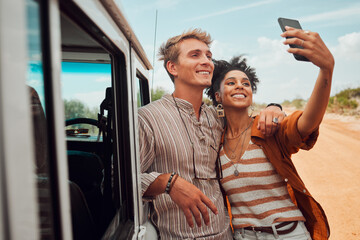 Couple, phone selfie and safari travel on game drive in nature environment, sand desert or dry Kenya landscape. Smile, happy and bonding interracial man and woman with 5g mobile technology photograph