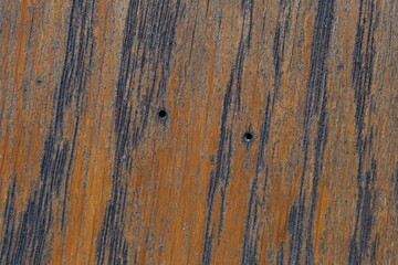 Wall Mural - Closeup of a brown wooden board