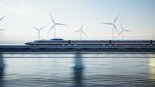 Fast Modern Train On Bridge Over Water With Wind Turbines In The Background