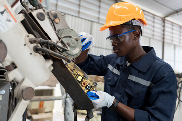 Aufkleber - Technician repair robotic arm in workshop. Engineer maintenance automatic robotic arm machines in factory. Industry robot manufacturing technology