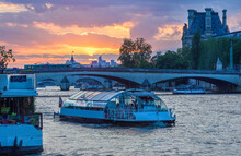 Bridge Pedestrian To Notre Dame And Recreational Boats In Seine River  And Pink Sunset!