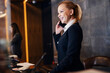 © Dusan Petkovic - A happy receptionist is making reservation at hotel reception.