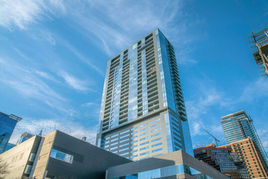 modern high-rise condominium with balconies in a low angle view at austin, texas. residential buildi