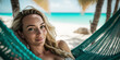 © ink drop - An attractive young woman relaxing in a hammock on a tropical beach holiday. Generative ai