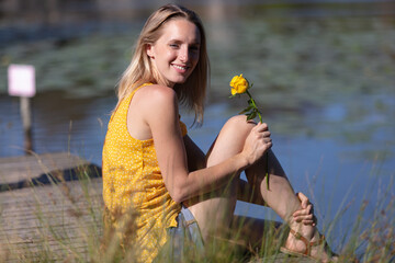 girl sitting by the lake