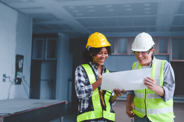 Wall Mural - Group of multi ethnic engineer construction site worker meeting at workplace, Architects working together at construction site to remodeling home or building.