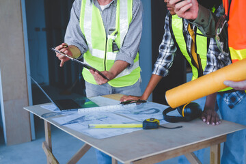 Wall Mural - Group of multi ethnic engineer construction site worker meeting at workplace, Architects working together at construction site to remodeling home or building.