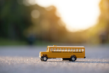 Wall Mural - Model of classical american yellow school bus for transporting of kids to and from school every day. Concept of education in the USA