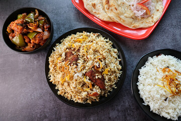 Wall Mural - Chicken biryani Spicy Indian Malabar biryani Hyderabadi biryani. Dum Biriyani pulao Kerala India Sri Lanka Pakistan. Basmati rice mixed rice dish with meat curry Ramadan Kareem Eid