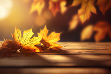 Creative Nature Composition. Beautiful Autumn Background With Orange Gold Maple Leaves On Background Of Sunlight With Soft Blurred Bokeh And Empty Wooden Table. With Copy Space. Podium, Stage	
