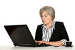© aletia2011 - old woman working with laptop on white background