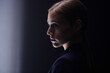 © Cavan Images - Side profile of a caucasian business woman with a serious expression on her face