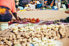 Low Section Of Vendor Selling Various Vegetables On Street In Market During Sunny Day