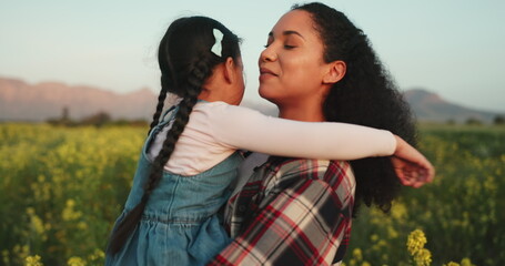 Wall Mural - Love, kiss and mother and girl in field on a farm, spring and peace with countryside flowers together. Family, garden or nature with mom and child bonding hug for support, growth and happy lifestyle