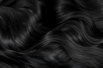 brunette or black hair. female long dark hair in black. beautifully laid curls. closeup texture in a