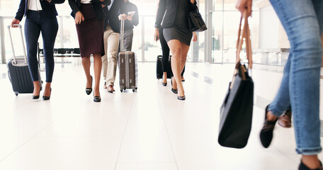 Aufkleber - To get somewhere in life youve got to get going. Cropped shot of a group of businesspeople walking through an airport with heir luggage.