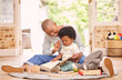 © D Lahoud/peopleimages.com - Its never too early to open a book. Shot of a young mother and daughter playing in the lounge at home.