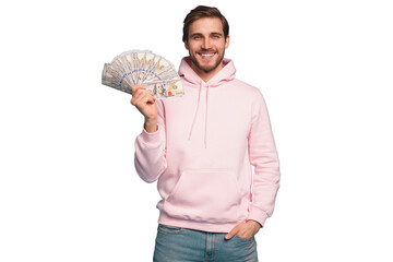 Portrait of a joyful young man holding money cash and celebrating isolated over transparent background