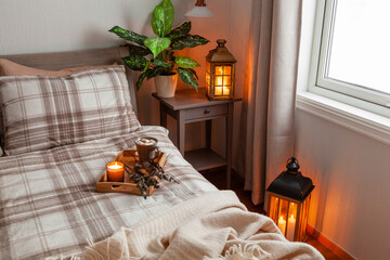 Wall Mural - cozy scandinavian bedroom interior in natural tones, blanket candles houseplants