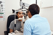 © Nicholas F/peopleimages.com - Cant see Come to me. Shot of a young woman getting her eyes examined with a slit lamp by an optometrist.