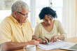 © Charlize D/peopleimages.com - Paperwork, budget and senior couple at home for retirement funds, investment planning or asset management together. Elderly people or woman and partner reading documents, financial loan or mortgage