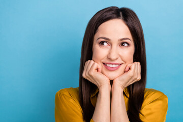 Sticker - Photo of dreamy adorable lady dressed yellow shirt arms cheeks looking emtpy space isolated blue color background