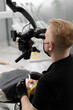 © Guys Who Shoot - Dentistry a dentist examines a patient through a microscope