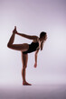 © Ivan Zelenin - Athletic woman in swimsuit, doing yoga, push-ups, beautiful female exercising at studio