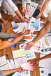 © Lune V A/peopleimages.com - Color, design palette and hands of business people on desk for branding meeting, strategy and marketing. Teamwork, paper and top view of designers brainstorming ideas, thinking and creative project