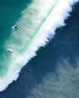 © AmazingAerialAgency - Aerial view of people doing surf on the waves along the shore in City Beach, Western Australia, Australia.
