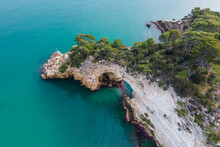 Aerial View Of Arco Di San Felice, A Natural Arch Along The Ionian Sea Coastline, Vieste, Gargano Natural Park, Puglia, Italy.