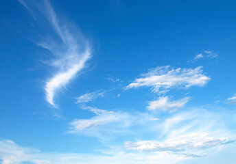 Wall Mural - Blue sky and white clouds background, soft focus and horizontal shape copy space.