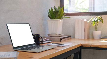 Fototapete - Laptop computer with blank screen, coffee cup on table Comfortable workplace..