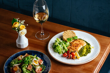 Wall Mural - grilled fish with side dish, vegetables and herbs